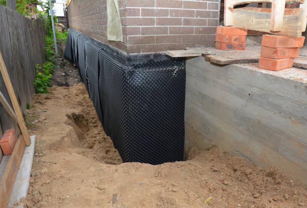 Happy homeowners after waterproofing job in Burton